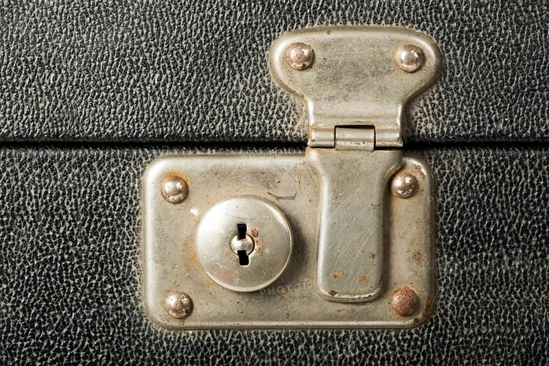 Lock of an old travel suitcase. Close up lock