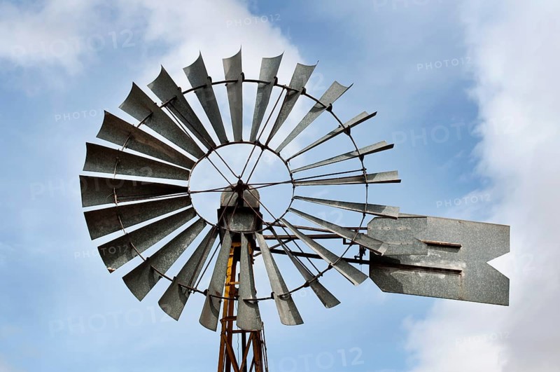 Old windmill over blue sky