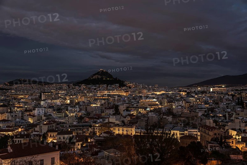 Athens Old Town, Attica, Greece, 12 28 2019 View over the Athens skyline and the Lycabettus hill during the blue hour, Europe