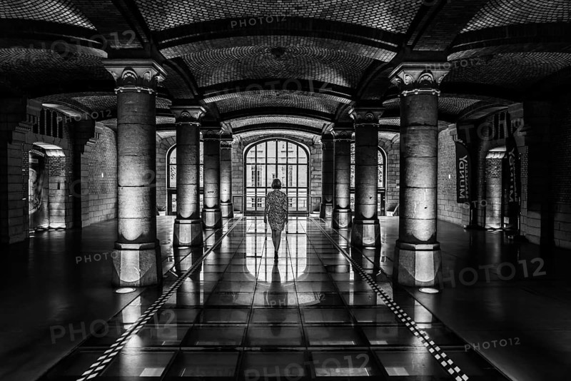 Woman in the Royal Depot warehouse of Thurn and Taxis, Brussels, belgium, August 2017