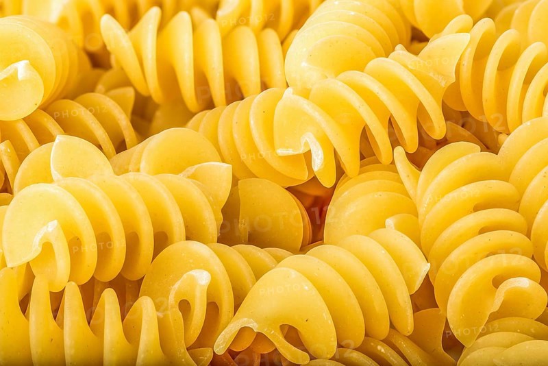 View of raw spiral pasta close up