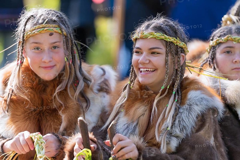 Two expression smiling girls in traditional clothing aboriginal of Kamchatka Peninsula. Itelmens national ritual festival of thanksgiving nature Alhalalalay. Kamchatka, Russian Far East, Sep 14, 2019