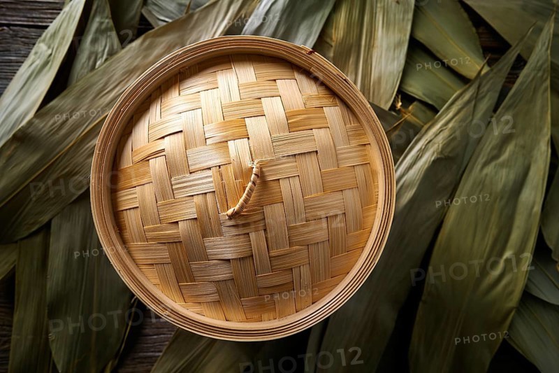 Asian kitchen bamboo steamer for steam cooking recipes on leafs