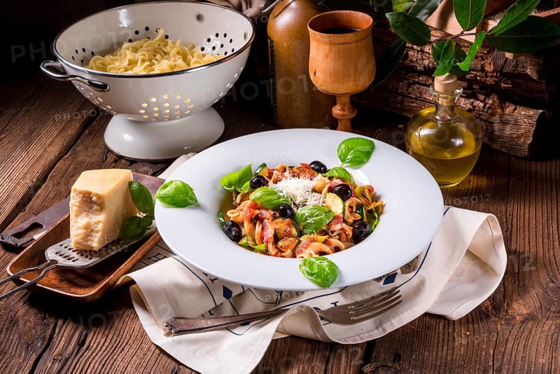 Ribbon Pasta with courgette and olives in tomato sauce