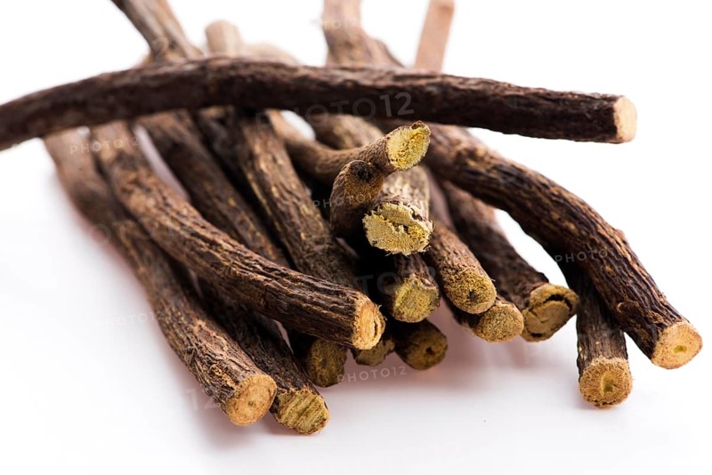 Licorice roots on white background