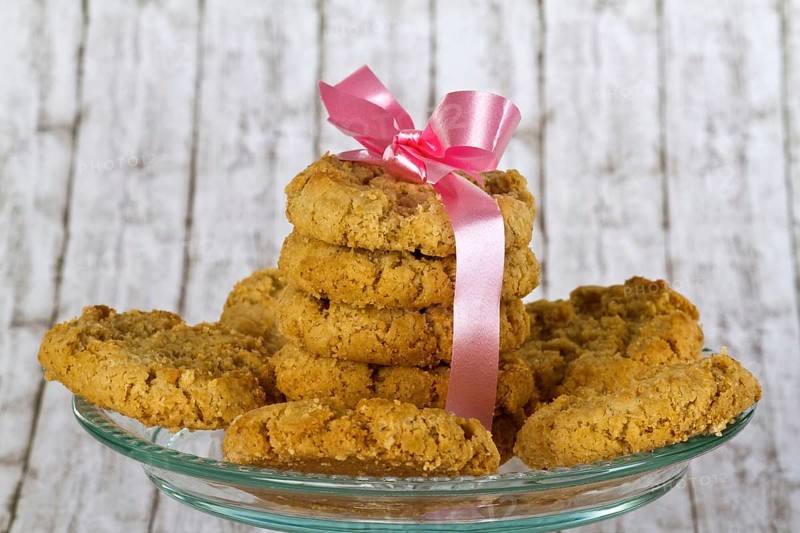 Delicious biscuits on a decorative background