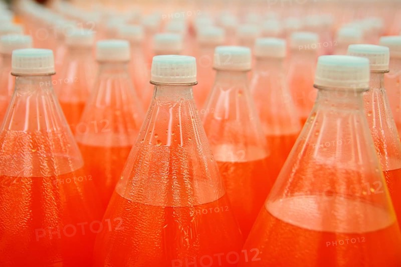 Orange juice beverage plastic bottle in factory line