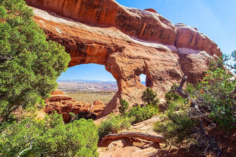 Picturesque red-brown sandstone cliffs form a unique landscape. Grandiose rock compositions natural origin. The various geological formations of Arches Park. Utah, USA, North America