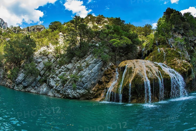 Scenic round waterfall in the side wall of the canyon Verdon. National park Merkantur, Provence, France. Photo taken fisheye lens