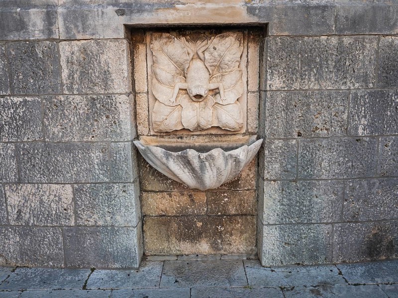 Stone relief, frog, fountain in the old town centre of Korcula, island of Korcula, Dalmatia, Croatia, Europe