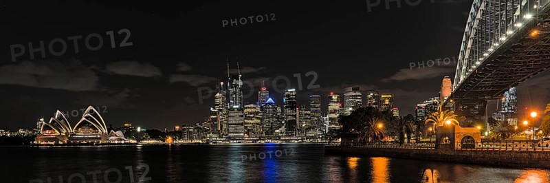 Sydney Opera House at night from Milsons Point and with skyline in the background. Reupload after color correction