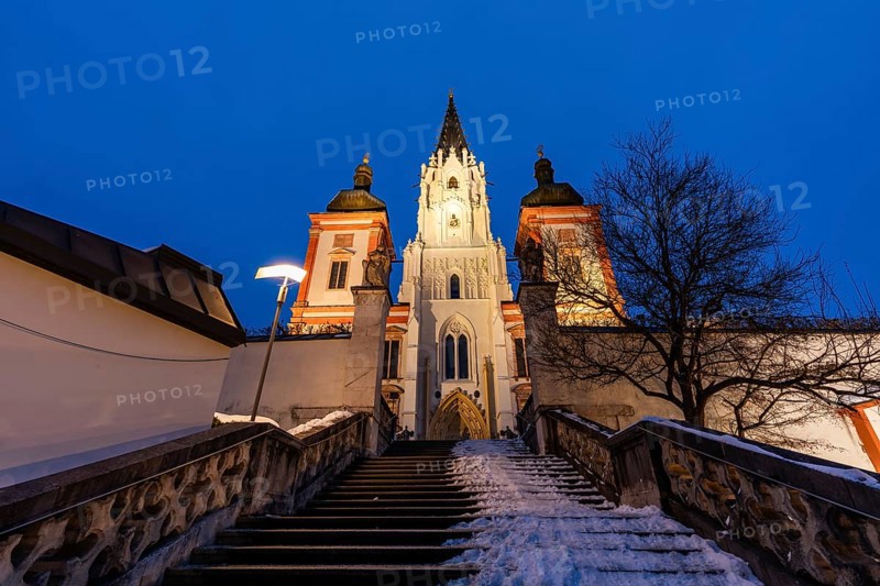 Snow on staircase, facade of the pilgrimage church, basilica of Mariazell, blue hour in the early morning, Mariazell, Styria, Austria, Europe