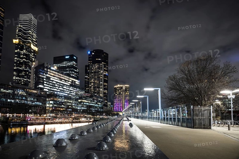 MELBOURNE, AUSTRALIA - JULY 5, 2024: Melbourne skyline as seen at dusk from Sandridge Bridge near Southbank in Melbourne, Victoria, Australia, Oceania