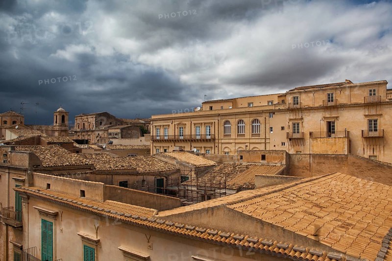 Above the rooftops before storm in Noto in Sicily