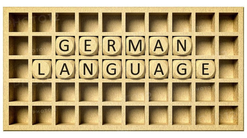 3d rendering of a wooden grid with cubes and the message german language