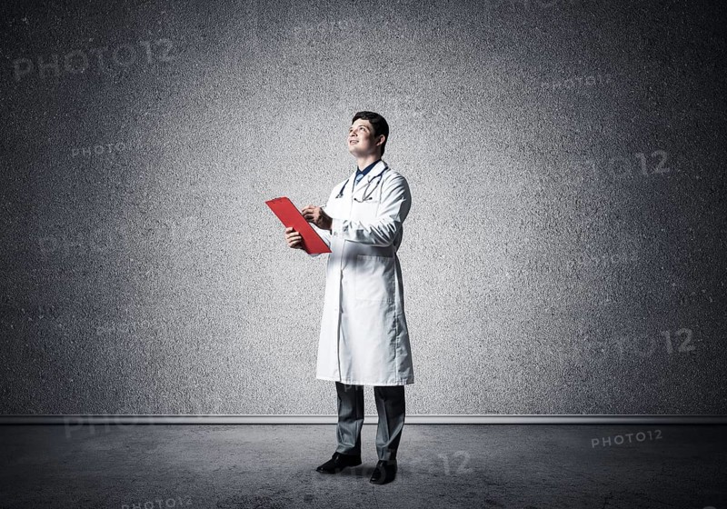 Portrait of the Doctor. Holds a tablet with documents in his hands and makes notes