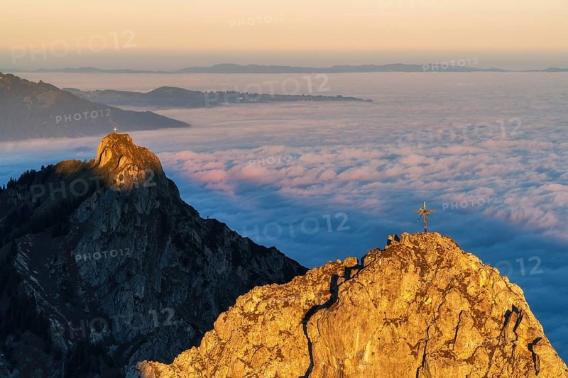 Peaks im Ammergauer Alpen alps at sunrise, above the clouds in the valley