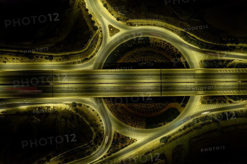Aerial drone top view of motorway junction. Roundabout with cars moving. Transportation infrastructure, Nicosia Cyprus