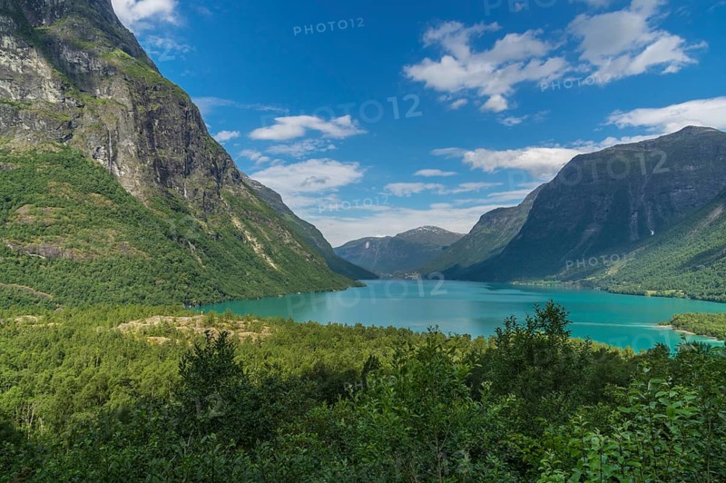 The Kjenndalsbreen is part of the Jostedalsbreen, one of the largest glaciers in Norway, and forms an impressive mountain landscape with a beautiful lake in Sande. The glacier Kjenndalsbreen with a lake in Norway is a beautiful place to travel to in summertime