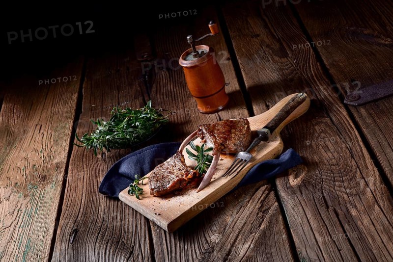 Grilled lamb chops on an old board