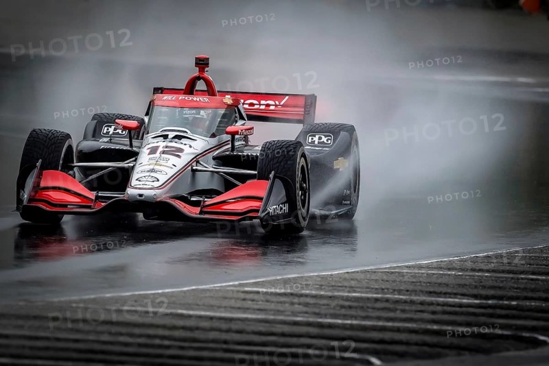 WILL POWER (12) of Toowoomba, Australia comes through turn 12 (Canada Corner) during a wet practice session for the XPEL Grand Prix at Road America in Elkhart Lake, WI