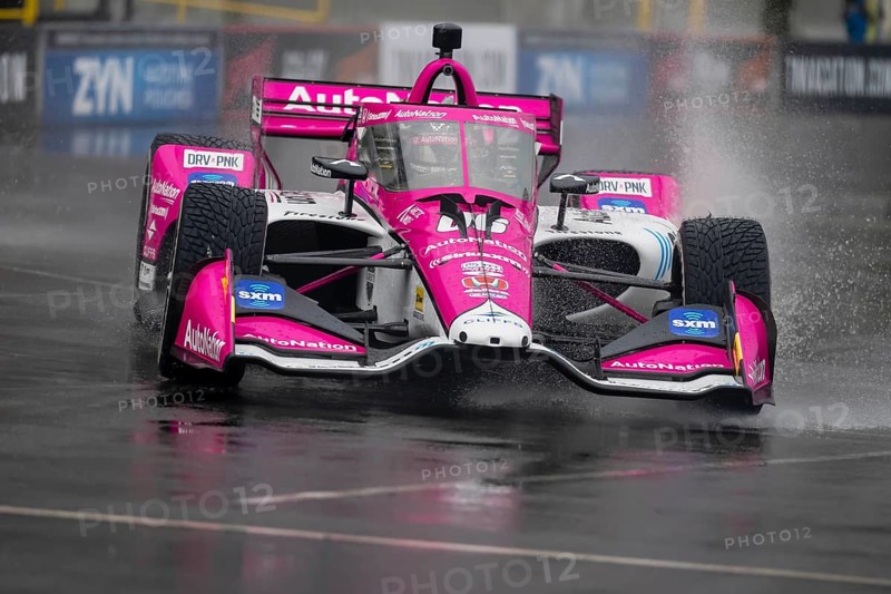 INDYCAR Series driver, HELIO CASTRONEVES (06) of Sao Paulo, Brazil, travels through the turns during a wet and dangerous practice session for the Big Machine Music City Grand Prix at Streets of Nashville in Nashville TN, South America