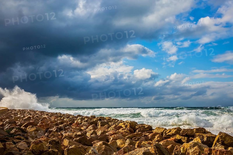 New Quay in the Old Jaffa in a winter storm. Huge foaming waves of the Mediterranean beat against the shore. Tel Aviv in January