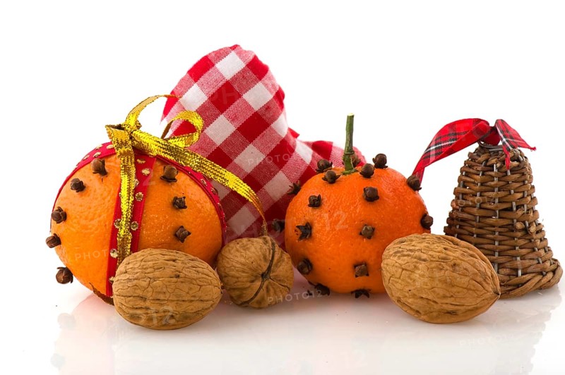 Christmas still life with orange cloves and walnuts