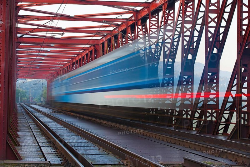 Speed train on the old iron railway bridge, Vsenory, Czech Republic, Europe