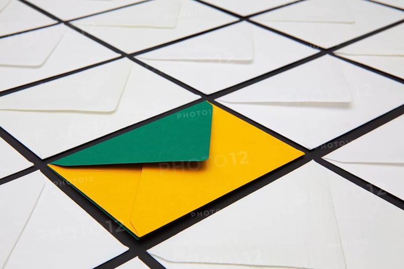 Composition with white and colored envelopes on the table. The photo suitable for various holidays and anniversaries