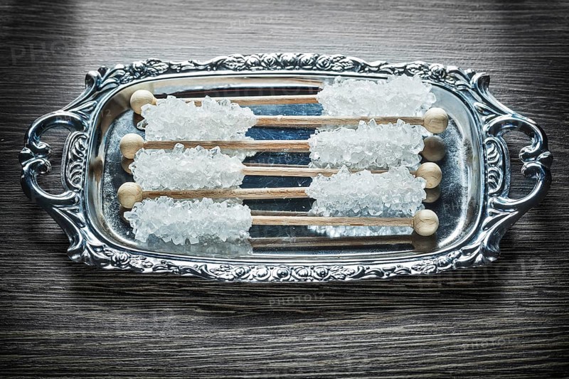 Sweet sugar sticks on metallic tray