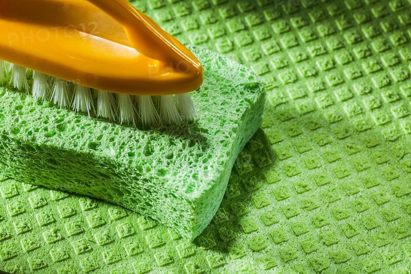 New plastic brush kitchen sponge on dishcloth