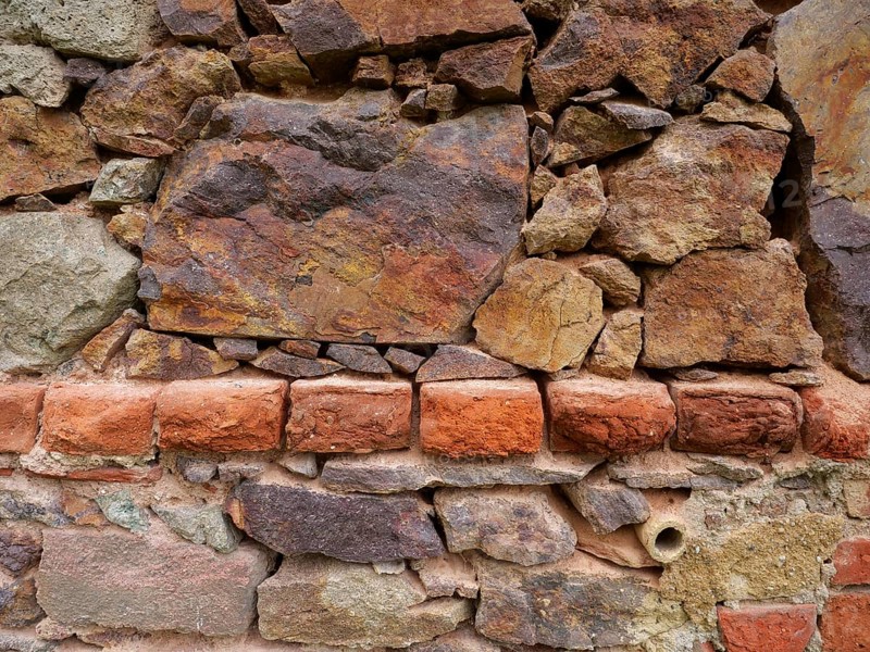Freestyle: fieldstone, porphyry and brick, textured background structure, rustic stone background