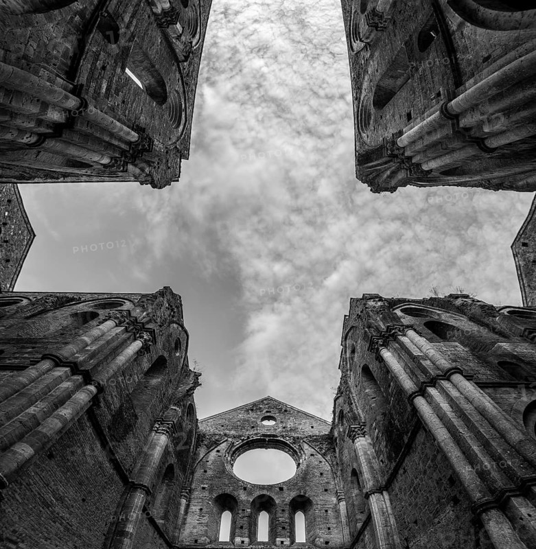 Missing ceiling opening the view to the sky in the destroyed abandoned Cistercian monastery San Galgano in the Tuscany, Italy, Europe