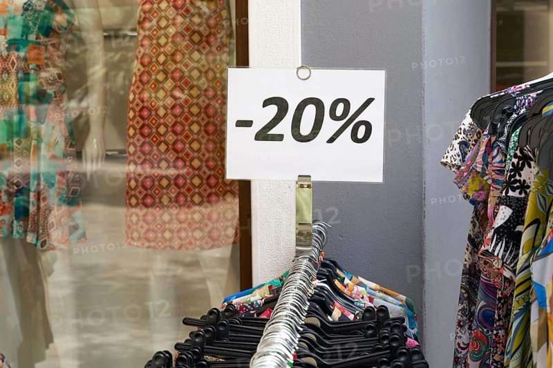 Notice of reduced-price clothing at a shop