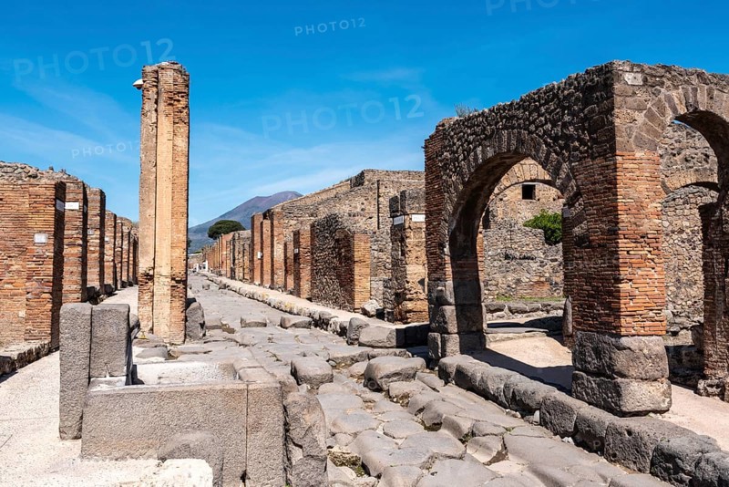 POMPEII, ITALY, MAY 04, 2022, A crosswalk of a typical Roman road in the ancient city of Pompeii, Southern Italy