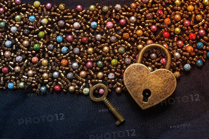 Heart shaped lock and key on an abstract background