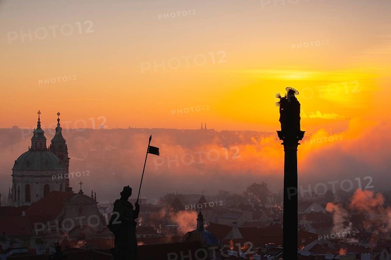 The Church of St.Nicholas in the mist. Prague, Czech Republic.This is the most famous Baroque church in Prague, stands along with the former Jesuit college in the centre of the Lesser Town Square