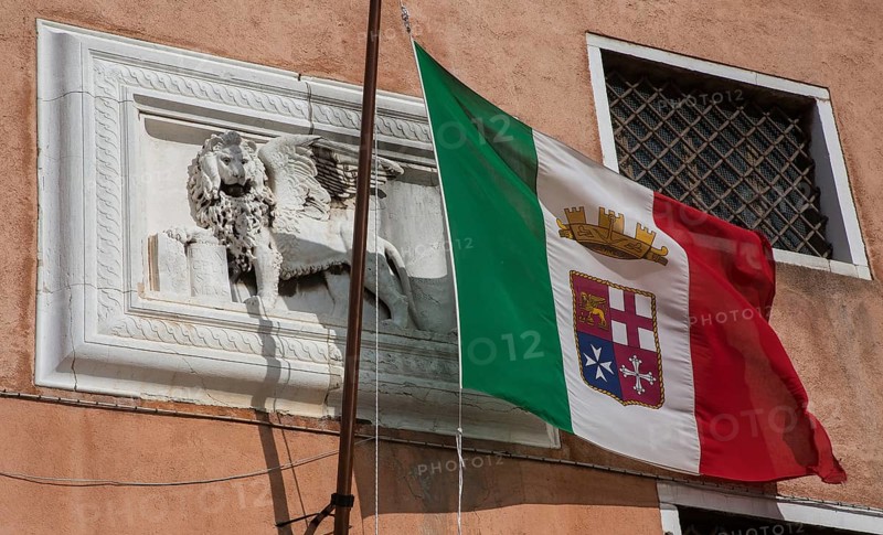 Italy Venice Museo Storico Navale -189 Maritime Museum at Campo San Biásio Façade section with relief of St Mark's lion and Italian naval flag