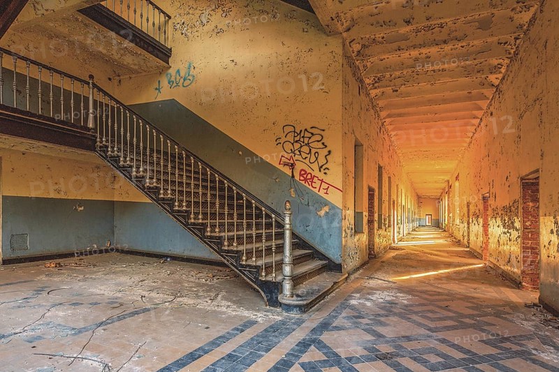 A long, deserted corridor with stairs and graffiti on the walls, Prison H11, Lost Place, Verviers, Province of Liège, Belgium, Europe