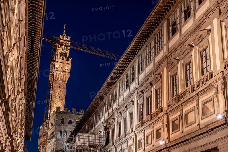 The famous Uffizi and the tower of the Palazzo Vecchio of Florence illuminated at night, Italy, Europe