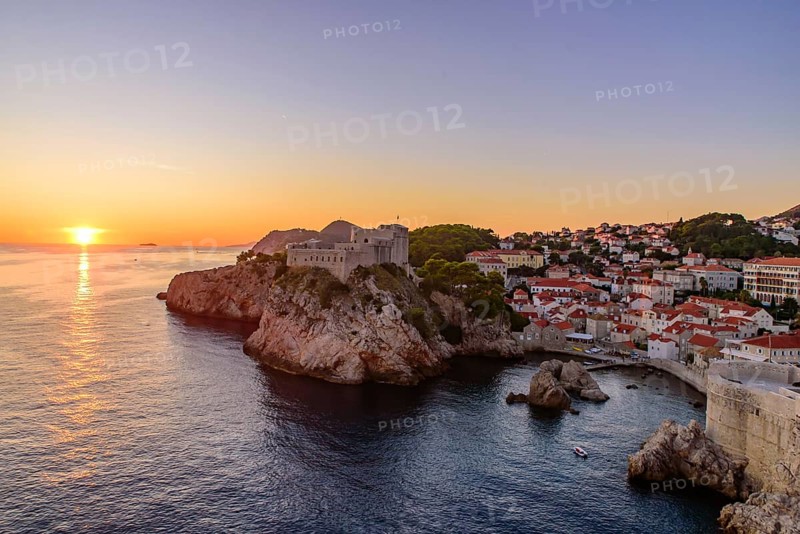 View of sunset with Fort Lovrijenac and Dubrovnik West Harbour in Croatia