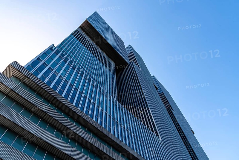 Rotterdam, Netherlands, May 8, 2022: De Rotterdam Skyscraper against sky. Designed by Rem Koolhaas architect. Contemporary architecture. Low angle view