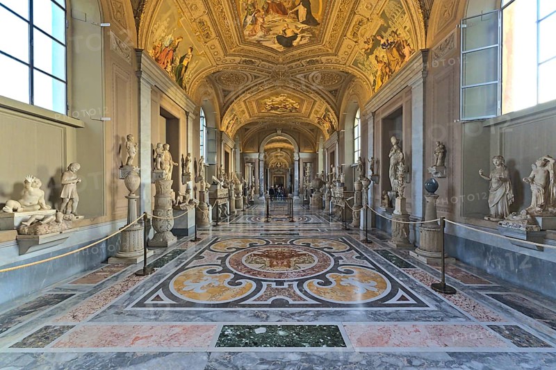 Inside of the Vaticans museums in one of the long hallways with few visitors
