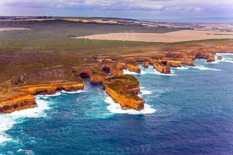 Australia. The Great Ocean Road goes along the Pacific coast. Picturesque shoreline. The picture was taken from the helicopter. The concept of extreme and active tourism