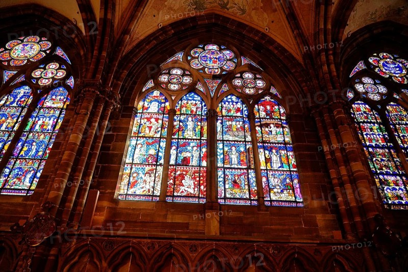 Strasbourg Cathedral, Cathedral of Our Lady, Cathédrale Notre-Dame, Cathedral, Strasbourg, Strasbourg, Bas-Rhin, Alsace, Alsace, France, Several stained glass windows with vivid religious scenes, framed in Gothic arches, Strasbourg, Strasbourg, Bas-Rhin, Alsace, Alsace, France, Europe