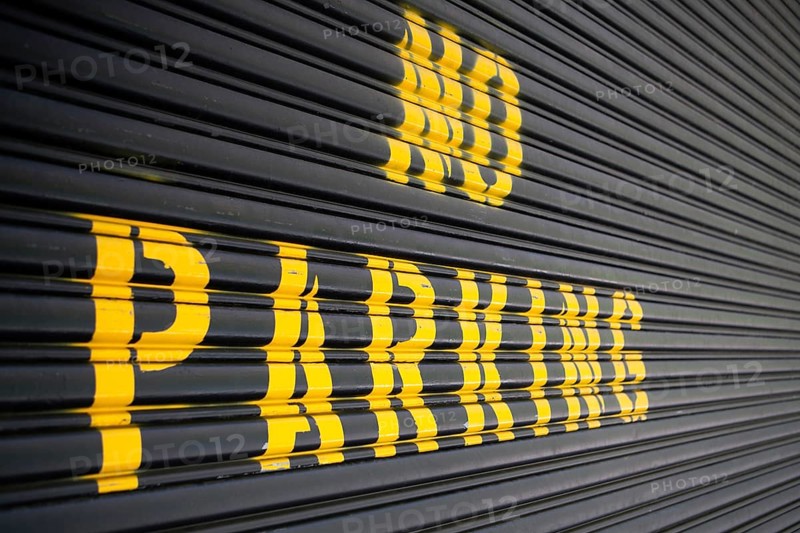 Steel roller garage door with the inscription No Parking