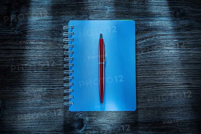 Set of notebooks pen on vintage wooden board