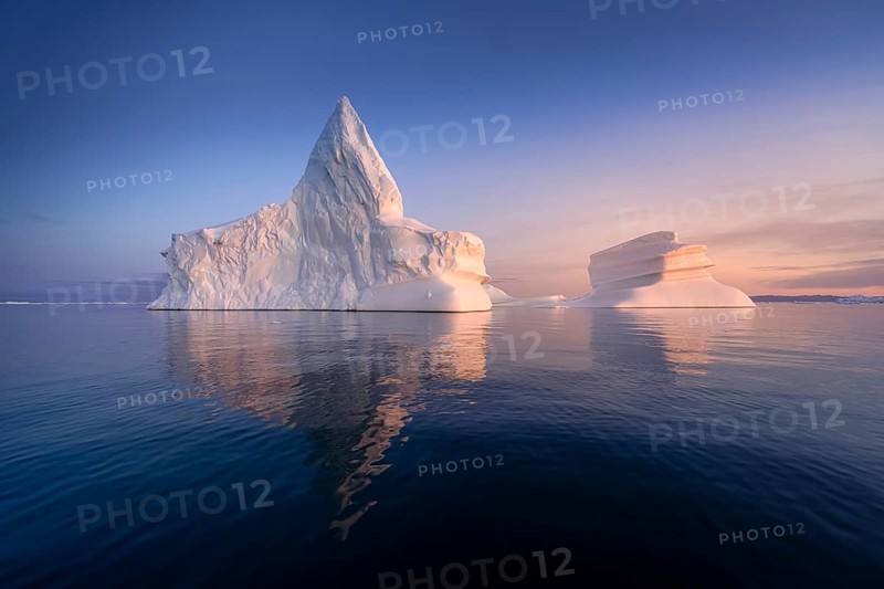 Floating glaciers in the rays of the setting sun at polar night