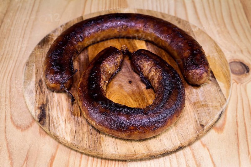 Fried Sausages On a Wooden Board